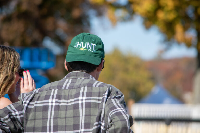 Guy at far hills horse race wearing a hunt club hat